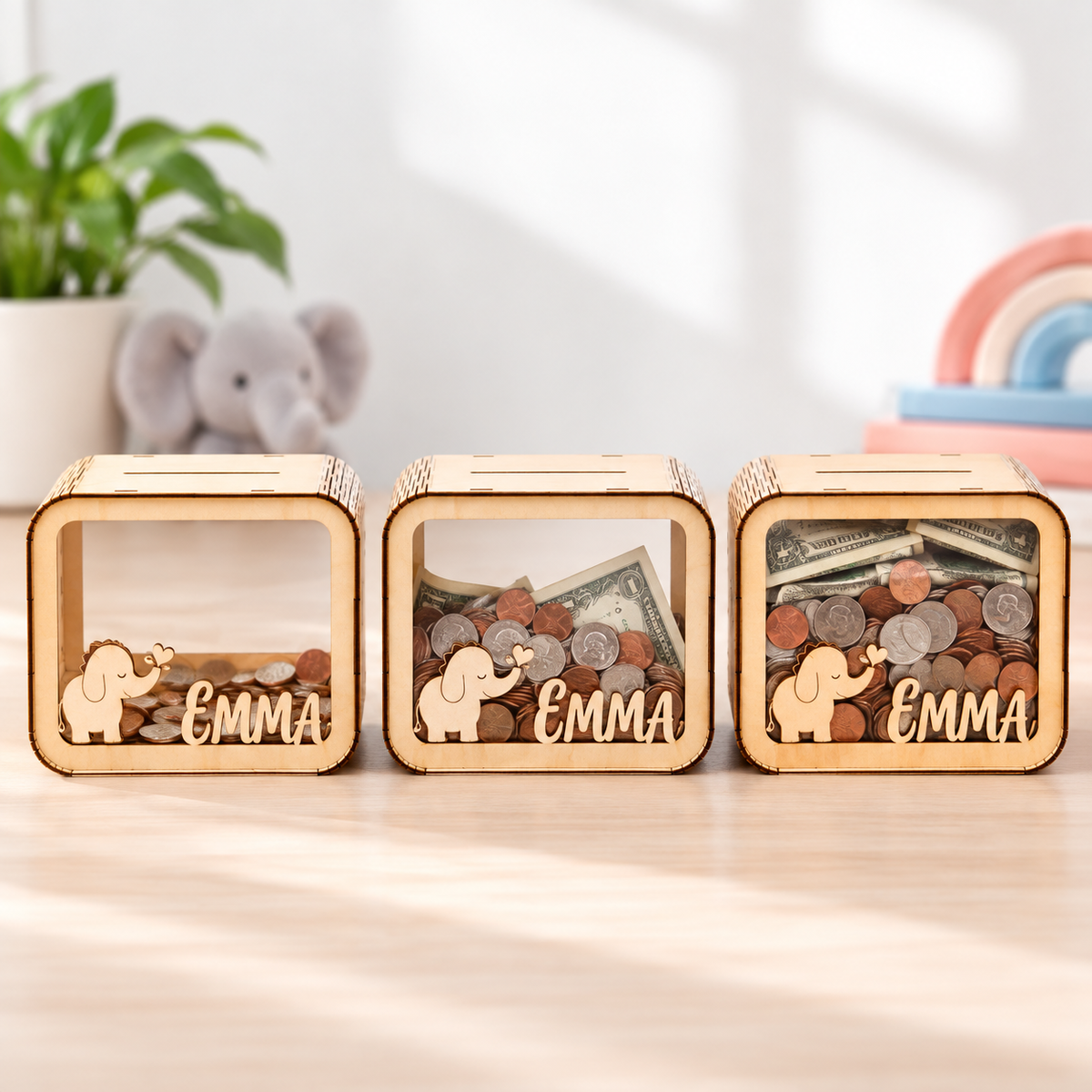 Three visible savings stages inside a personalized wooden bank
